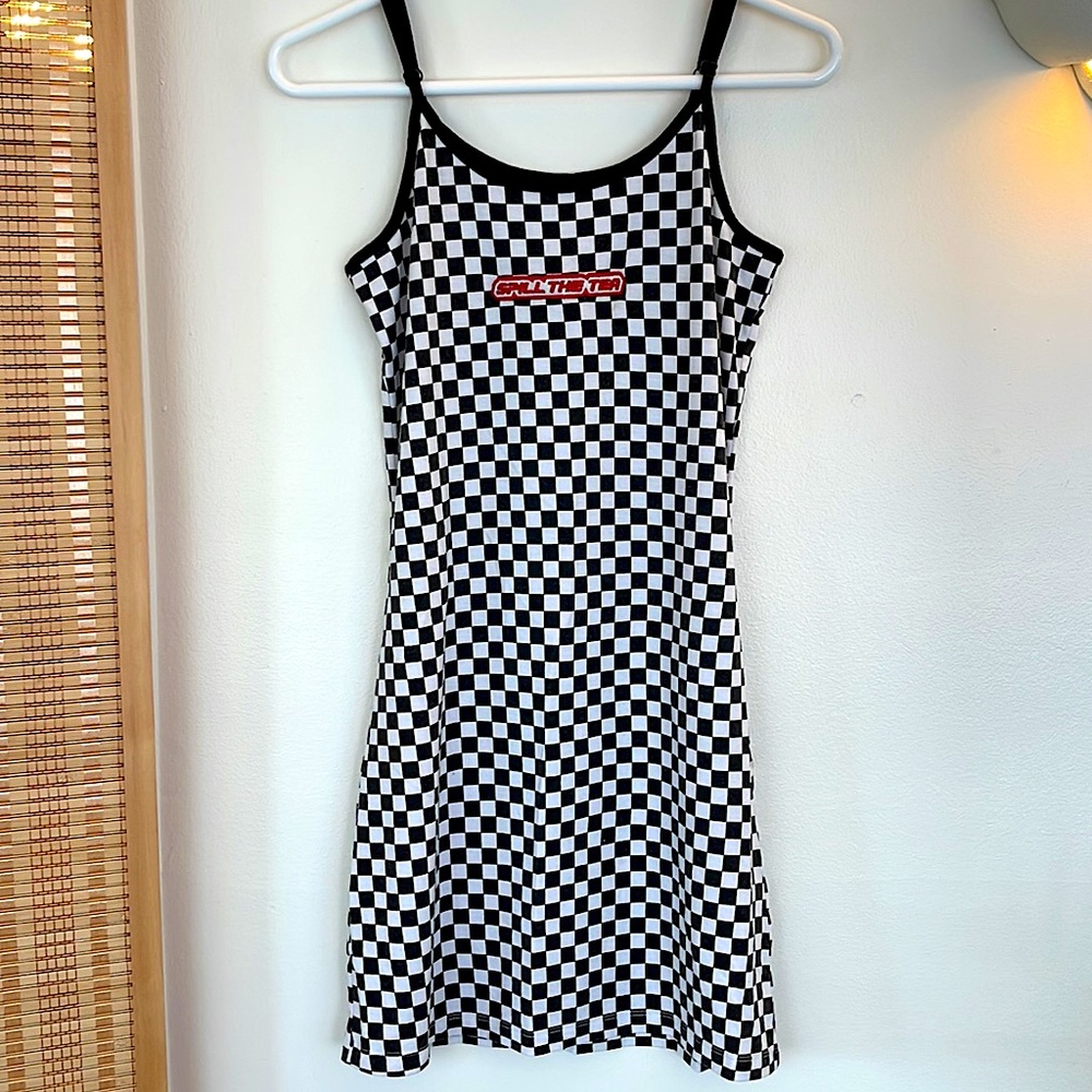 Checkered dress with “spill the tea” on the front in an embroidered patch🖤